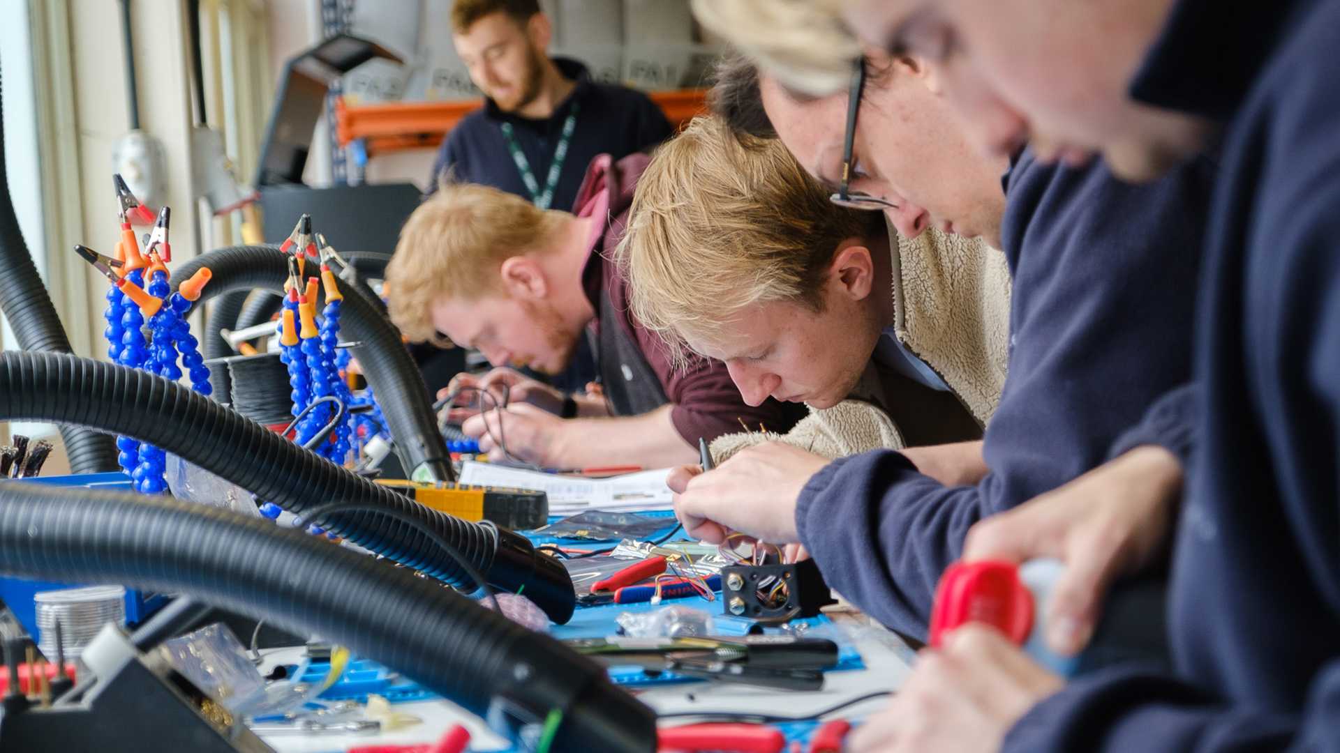 Workers assembling components